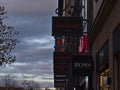 Several billboards in a row above shops in shopping street KÃÂ¶nigstraÃÅ¸e in downtown including brands Hugo Boss and New Yorker.